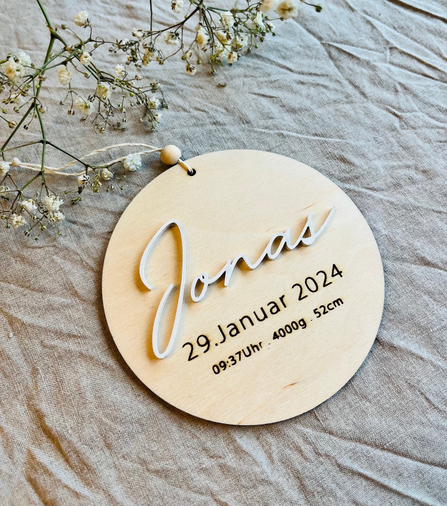 Namensschild mit Geburtsdaten